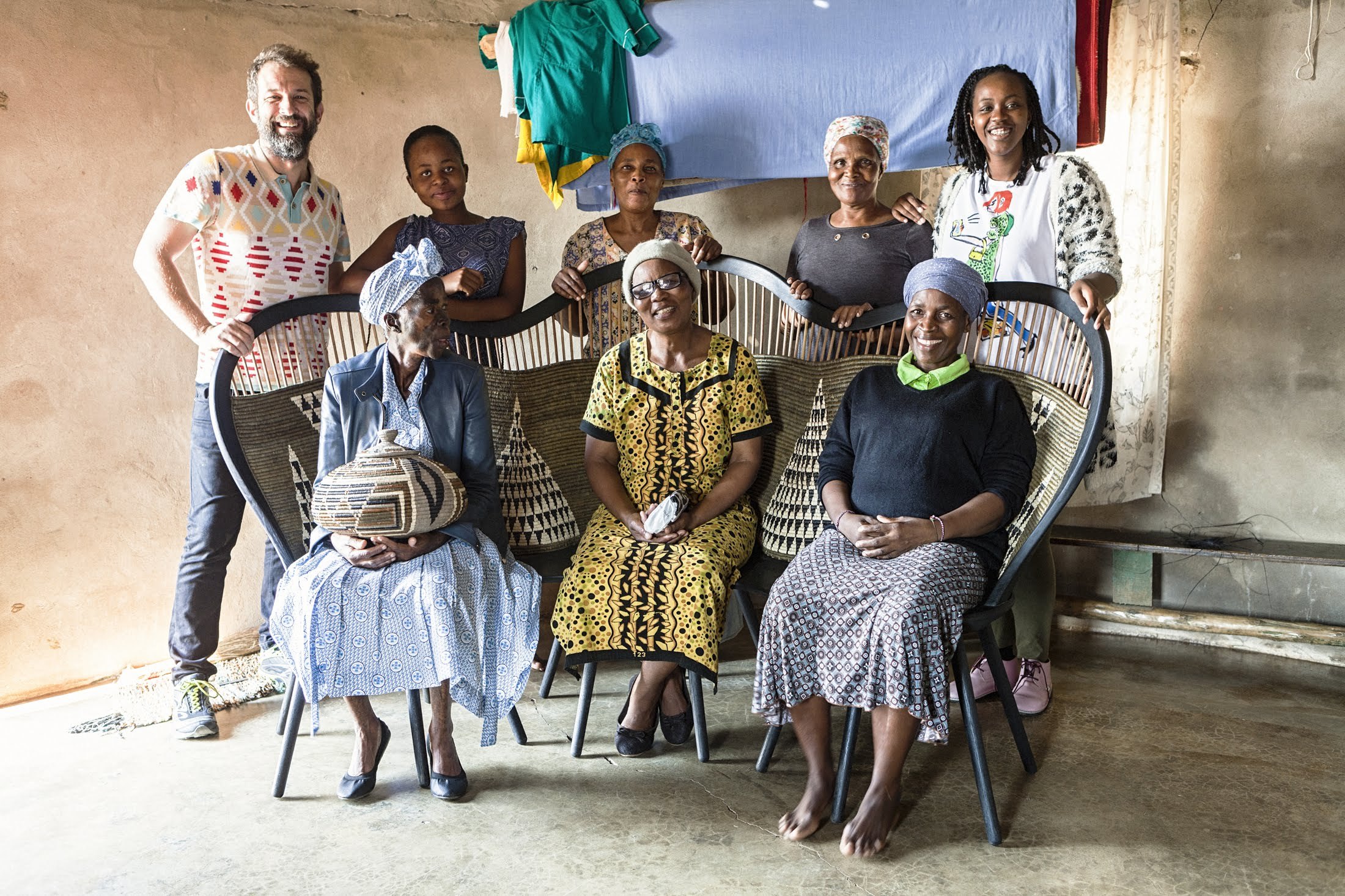 The Hlabisa Bench with the master weavers who wove it